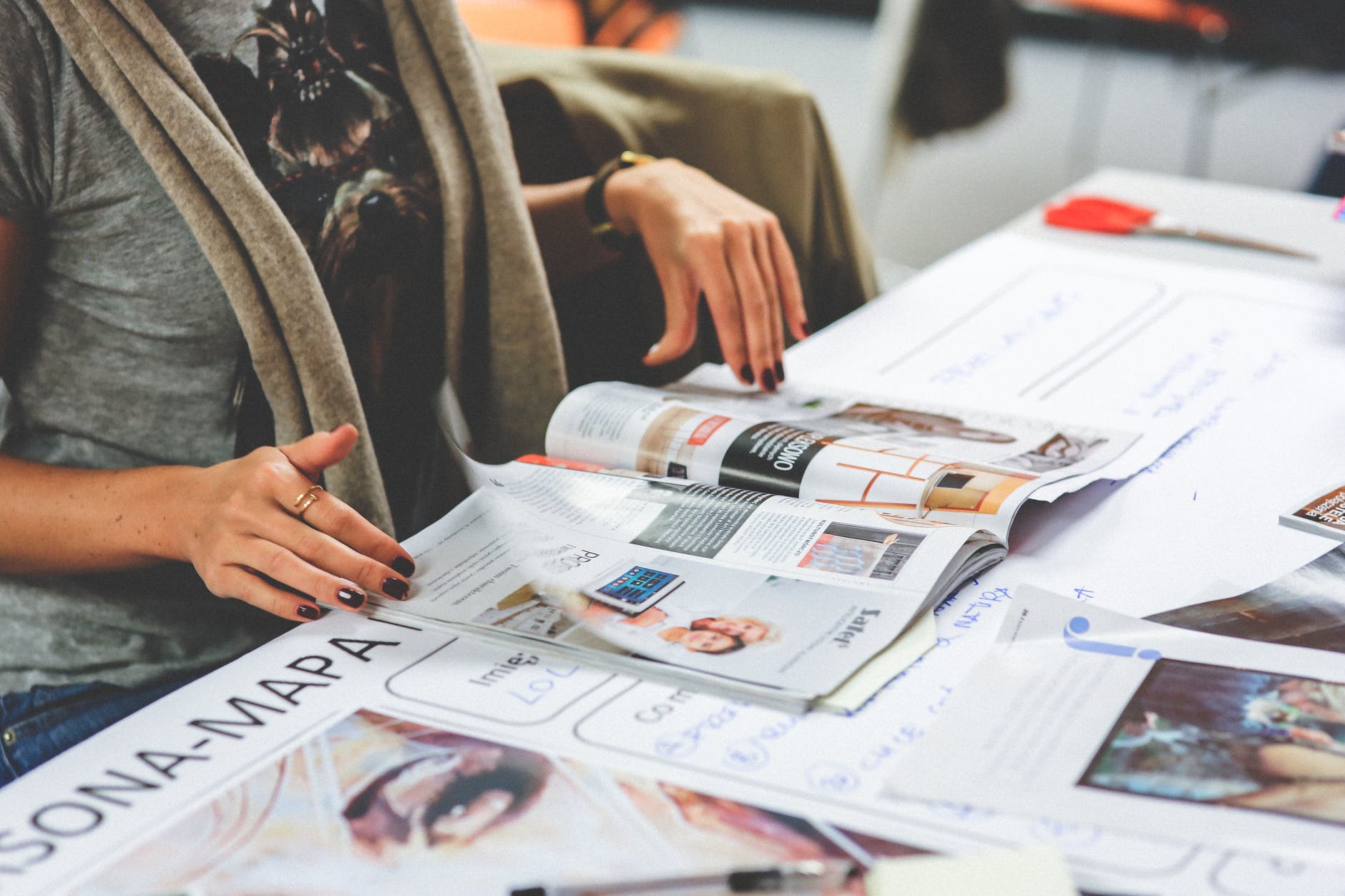 girl reading a newspaper